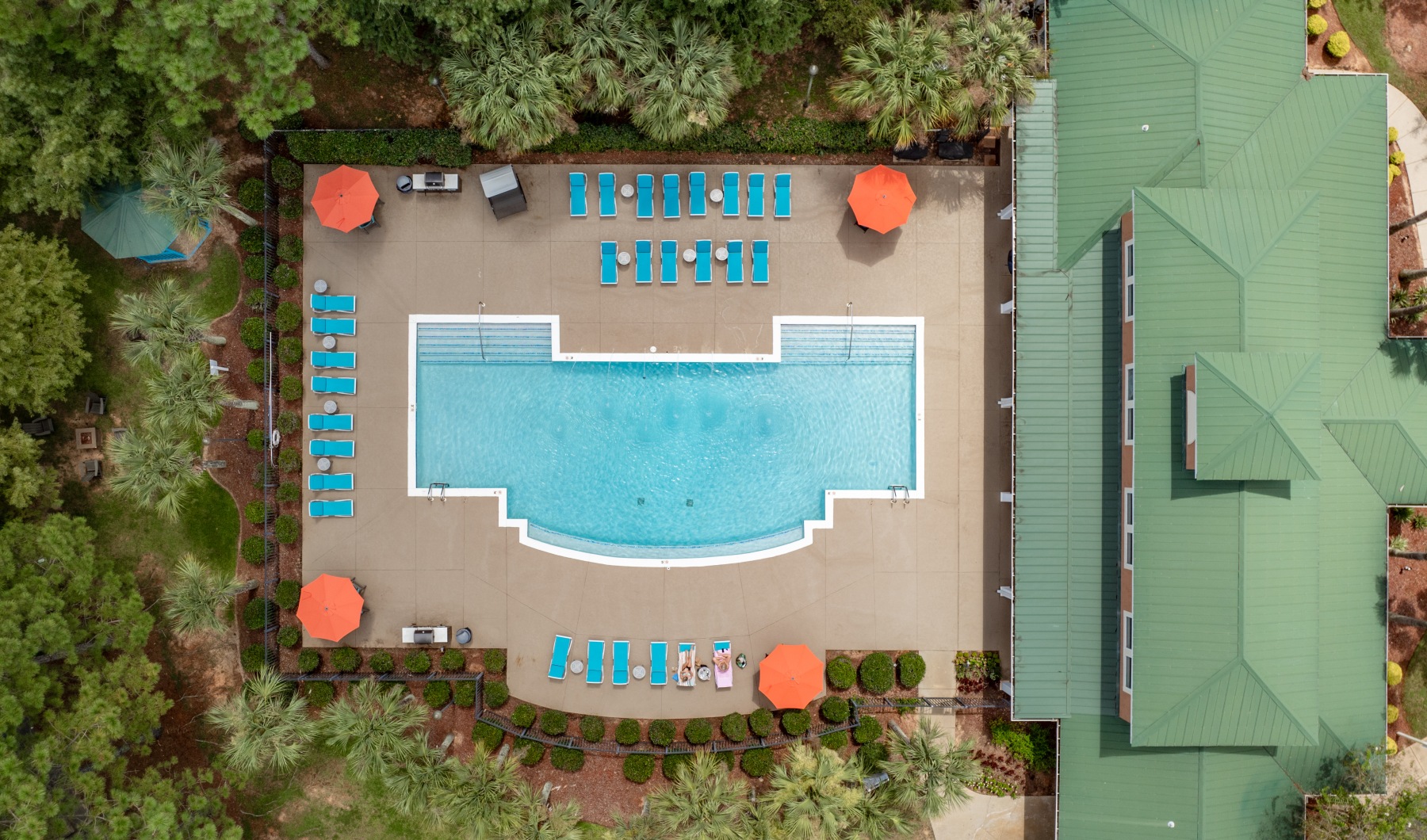 a pool with chairs around it