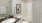 a bathroom with a white tile shower