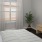 a bedroom with a large window