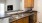 a kitchen with natural wooden cabinets