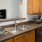 a kitchen with natural wooden cabinets