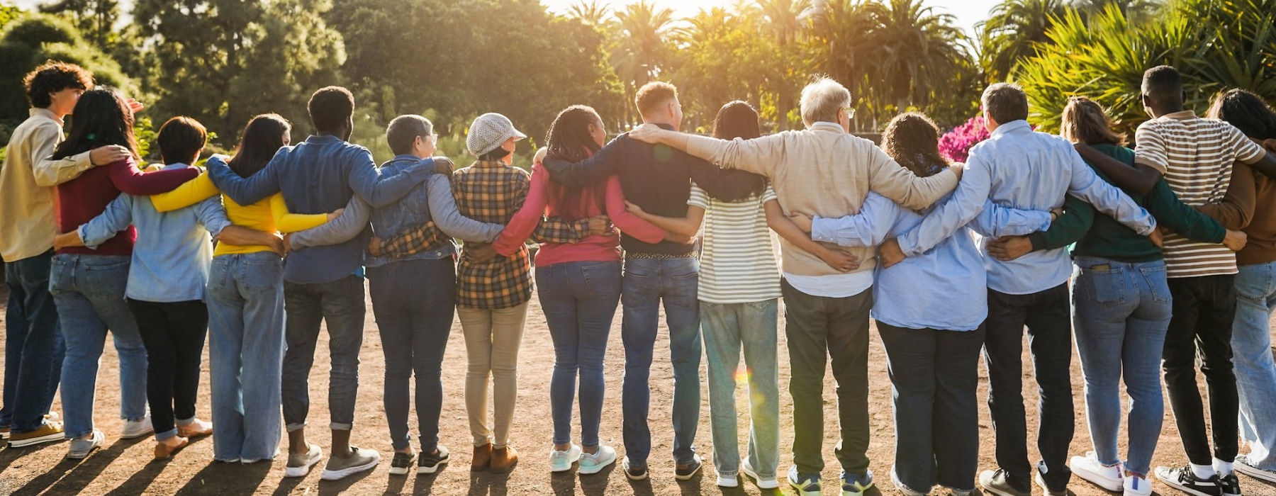 line of people with arms around each other's backs